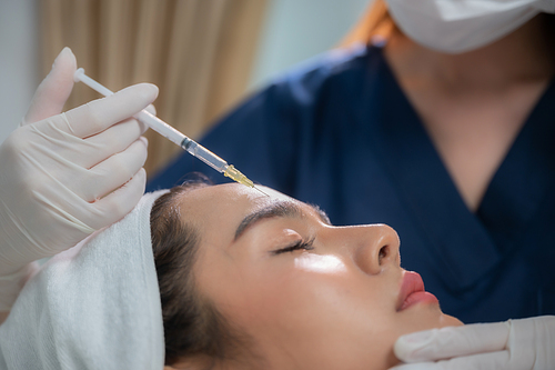 young Asian woman making cosmetology treatment skin injection, Mesotherapy of face beauty care