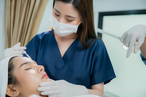 young Asian woman making cosmetology treatment skin injection, Mesotherapy of face beauty care