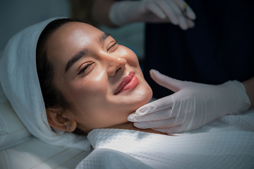 young Asian woman making cosmetology treatment skin injection, Mesotherapy of face beauty care