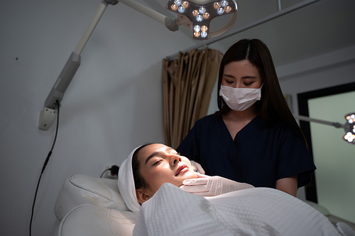 young Asian woman making cosmetology treatment skin injection, Mesotherapy of face beauty care