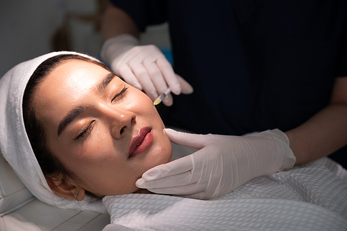 young Asian woman making cosmetology treatment skin injection, Mesotherapy of face beauty care