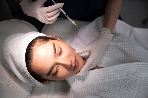 young Asian woman making cosmetology treatment skin injection, Mesotherapy of face beauty care