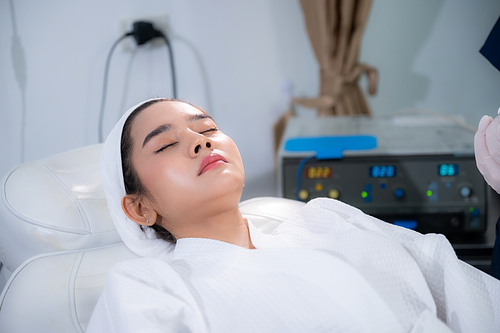 young Asian woman making cosmetology treatment skin injection, Mesotherapy of face beauty care