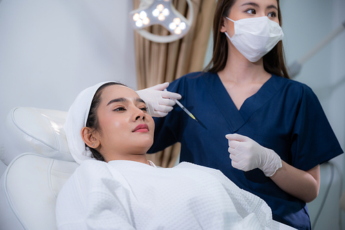 young Asian woman making cosmetology treatment skin injection, Mesotherapy of face beauty care