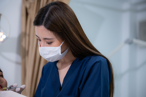 young Asian woman making cosmetology treatment skin injection, Mesotherapy of face beauty care