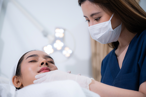 young Asian woman making cosmetology treatment skin injection, Mesotherapy of face beauty care