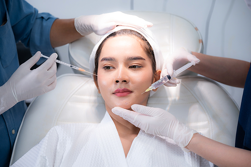 young Asian woman making cosmetology treatment skin injection, Mesotherapy of face beauty care