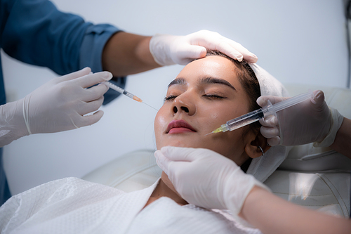 young Asian woman making cosmetology treatment skin injection, Mesotherapy of face beauty care