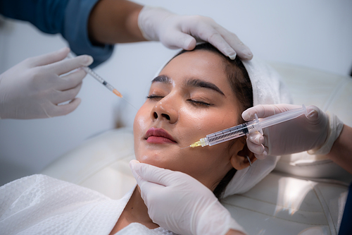 young Asian woman making cosmetology treatment skin injection, Mesotherapy of face beauty care