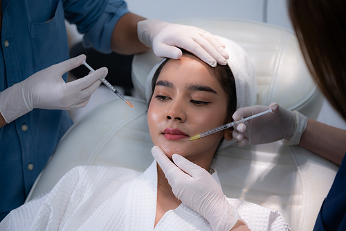 young Asian woman making cosmetology treatment skin injection, Mesotherapy of face beauty care