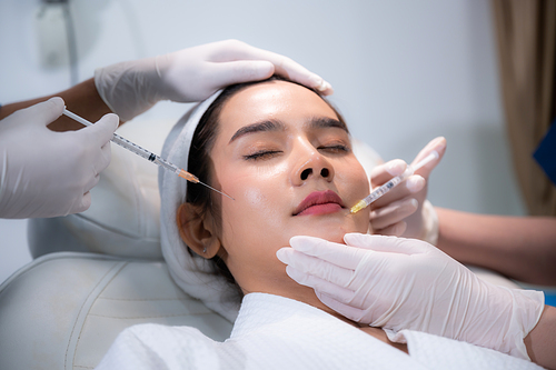 young Asian woman making cosmetology treatment skin injection, Mesotherapy of face beauty care