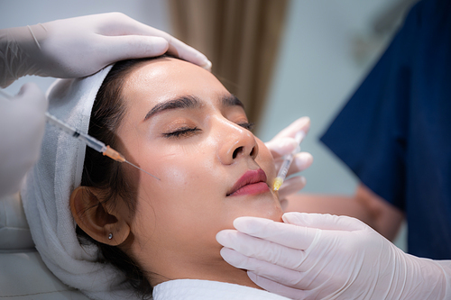 young Asian woman making cosmetology treatment skin injection, Mesotherapy of face beauty care