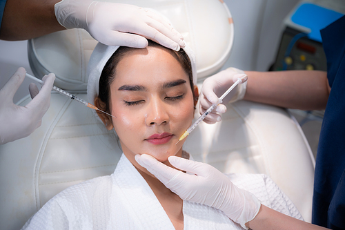 young Asian woman making cosmetology treatment skin injection, Mesotherapy of face beauty care