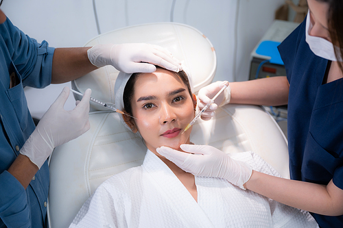 young Asian woman making cosmetology treatment skin injection, Mesotherapy of face beauty care