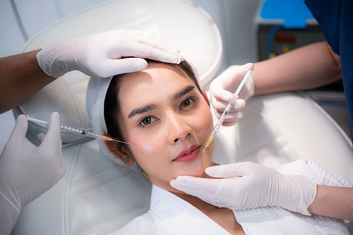 young Asian woman making cosmetology treatment skin injection, Mesotherapy of face beauty care