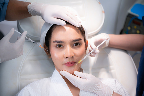 young Asian woman making cosmetology treatment skin injection, Mesotherapy of face beauty care