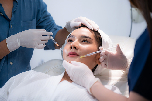 young Asian woman making cosmetology treatment skin injection, Mesotherapy of face beauty care