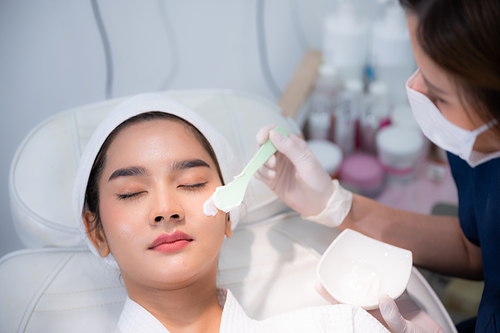 young woman patient with a therapy treatment of cosmetic face skin, surgery medicine concept