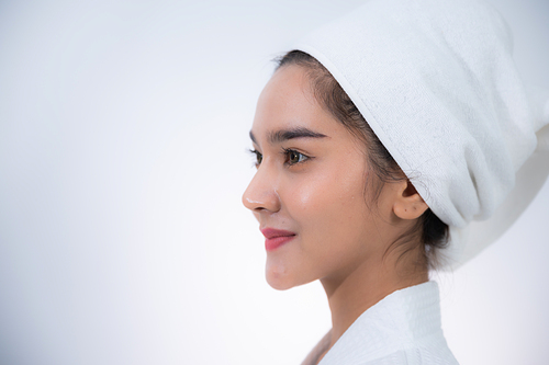 young Asian woman making treatment cosmetic beauty therapy on a face at cosmetological clinic