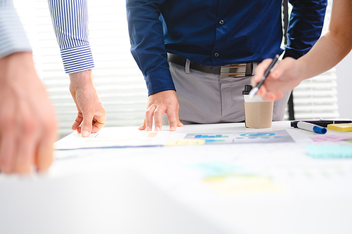 Serious diverse business team leader discuss financial paperwork, Smart businessman and businesswoman partner teamwork talking discussion in group meeting at office table in modern office interior