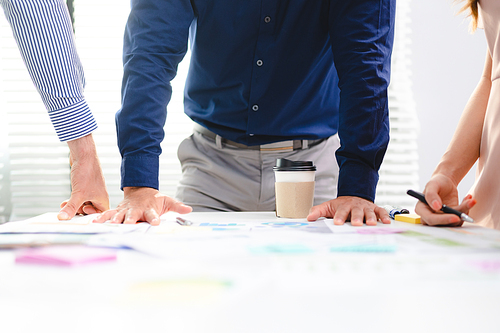 Serious diverse business team leader discuss financial paperwork, Smart businessman and businesswoman partner teamwork talking discussion in group meeting at office table in modern office interior