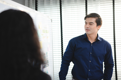 Serious diverse business team leader discuss financial paperwork, Smart businessman and businesswoman partner teamwork talking discussion in group meeting at office table in modern office interior