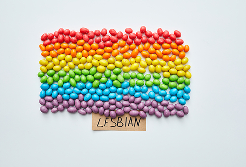 Lesbian colorful flag: small jellybeans of various colors laid out in shape of flag devoted to lesbians